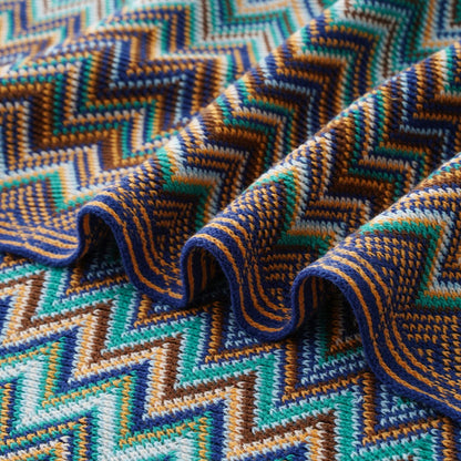 Cobija boho tejida con flecos