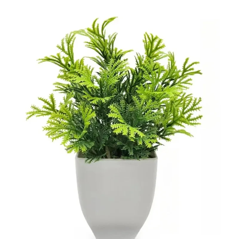 Planta artificial en maceta blanca